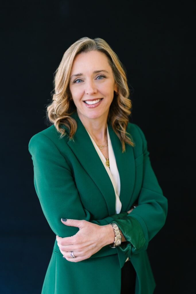 woman wearing green blazer