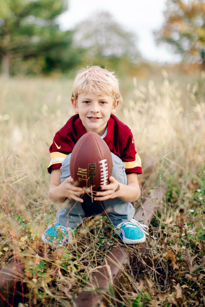 Boy holding football