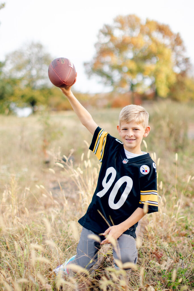 Boy holding a football