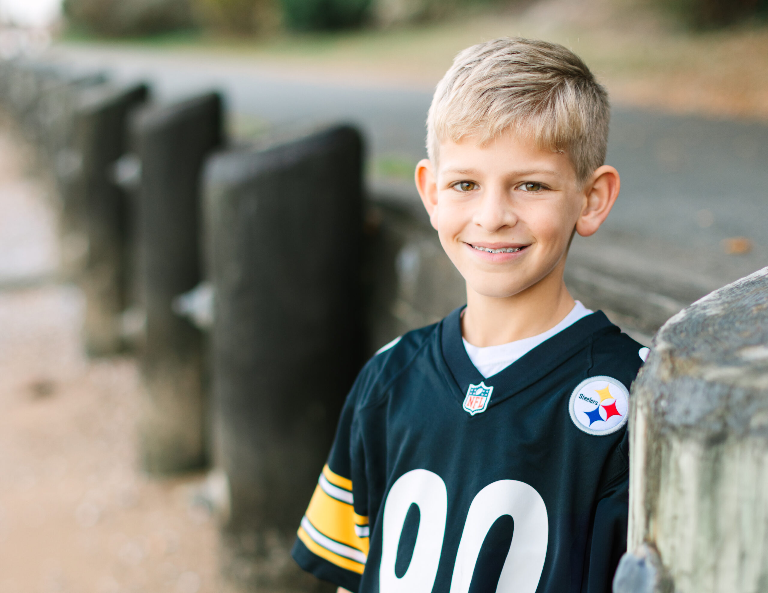 boy wearing football jersey