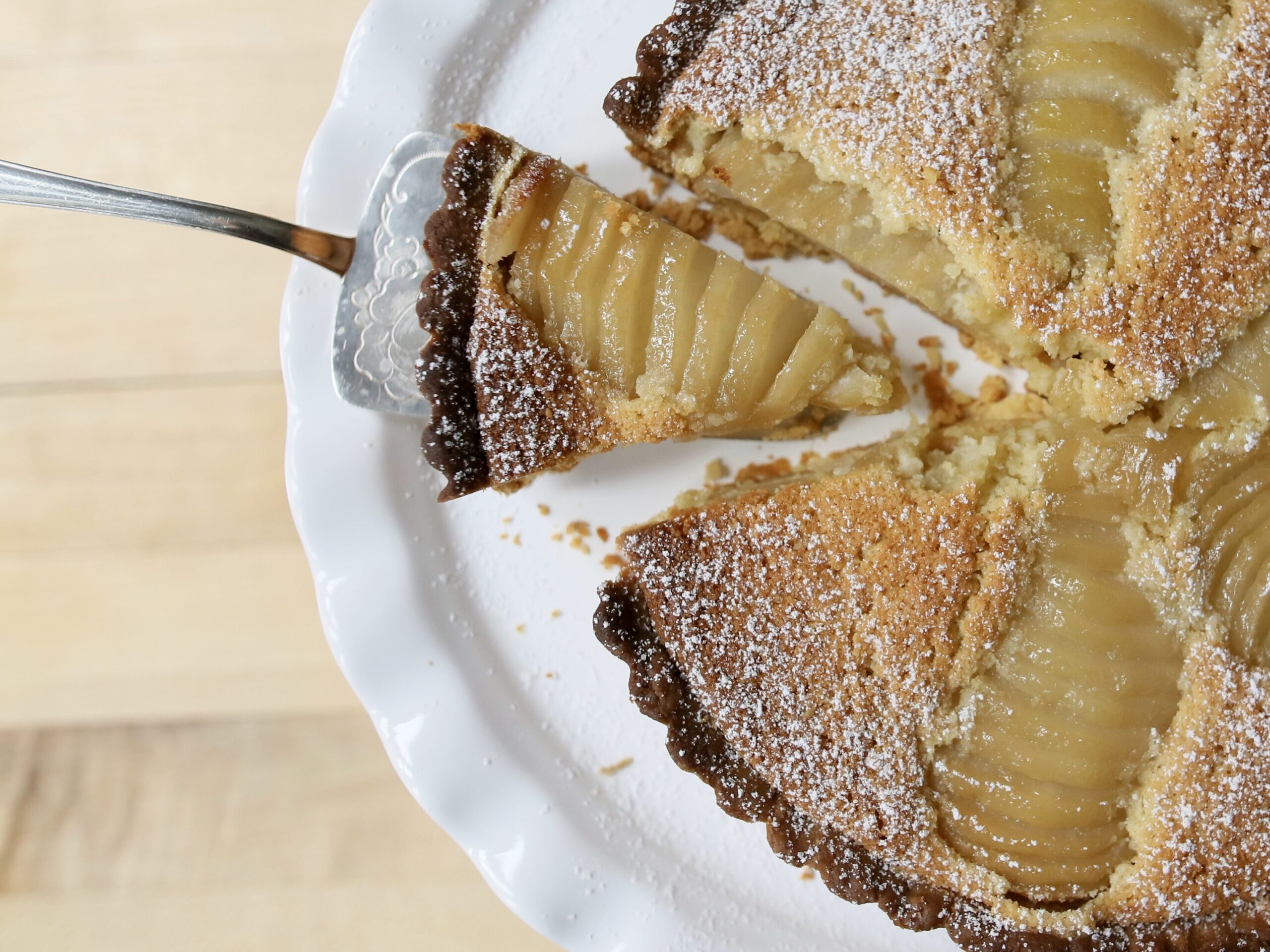 Flat lay of a Pear tart on a cake stand for brand photography