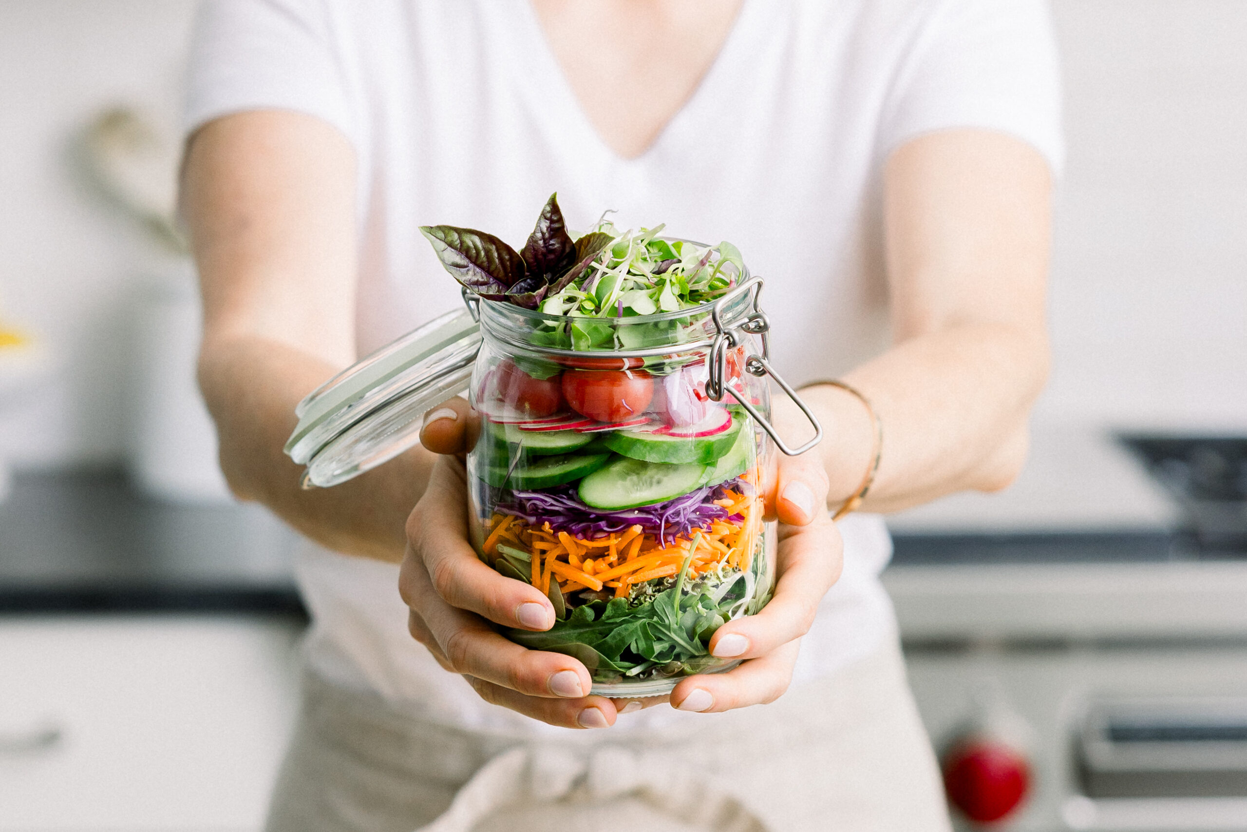 Detailed image of prepared vegetables in a glass jar.