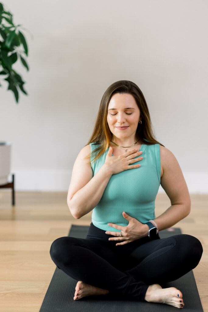 Yoga teacher in a meditation pose.