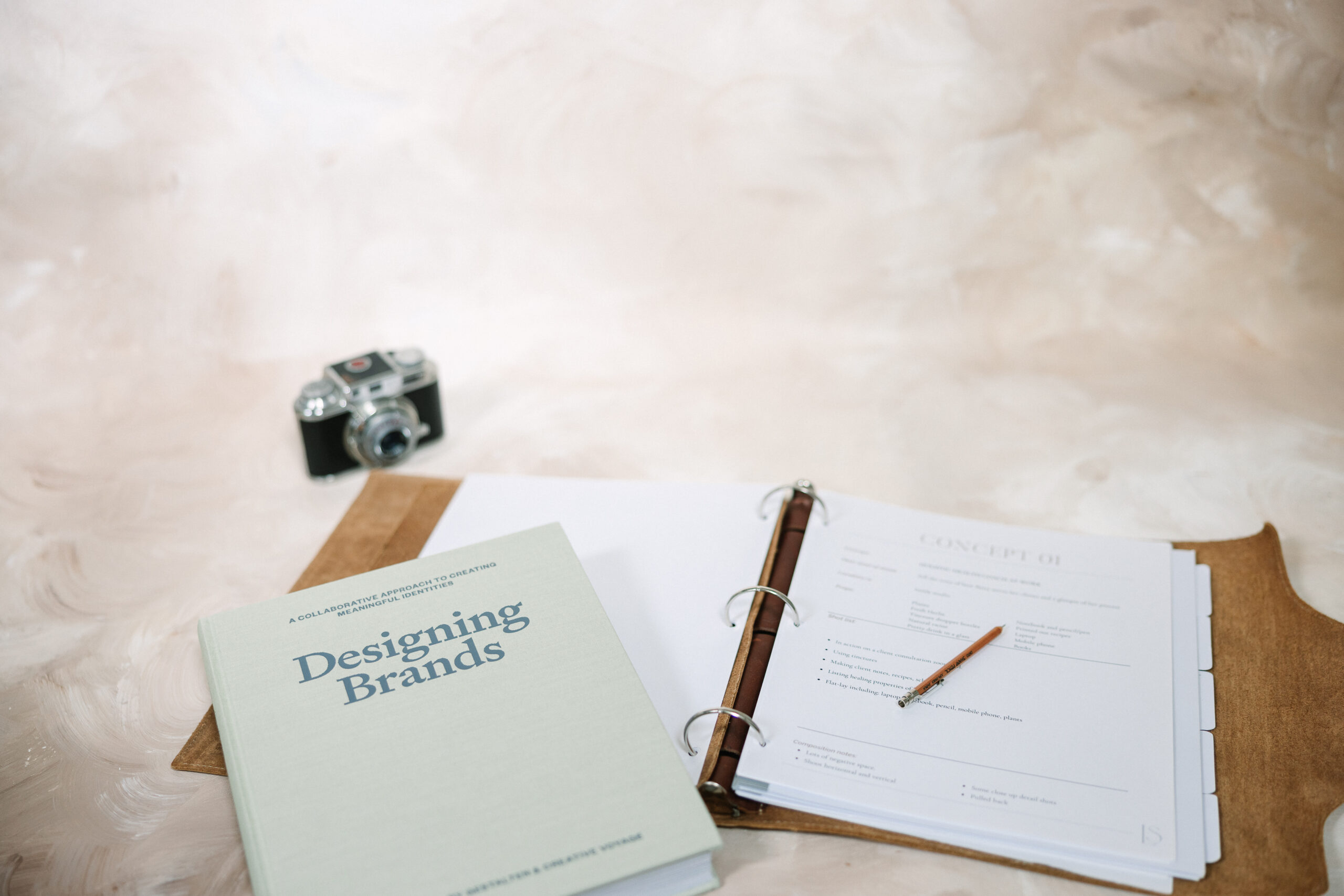 Ring binder containing a Creative Brief document for a Branding Photography photo shoot.