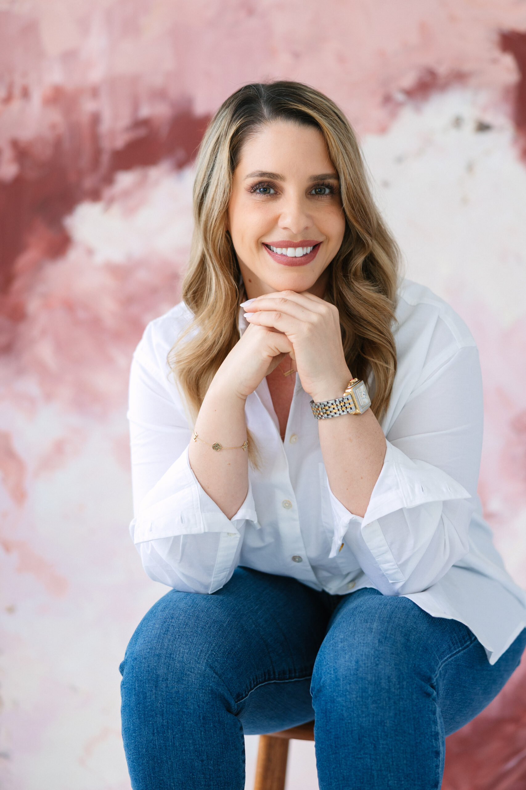 Example of a personal brand headshot in DC & Alexandria VA, using a vibrant, hand-painted backdrop that was created using the client's brand colors.