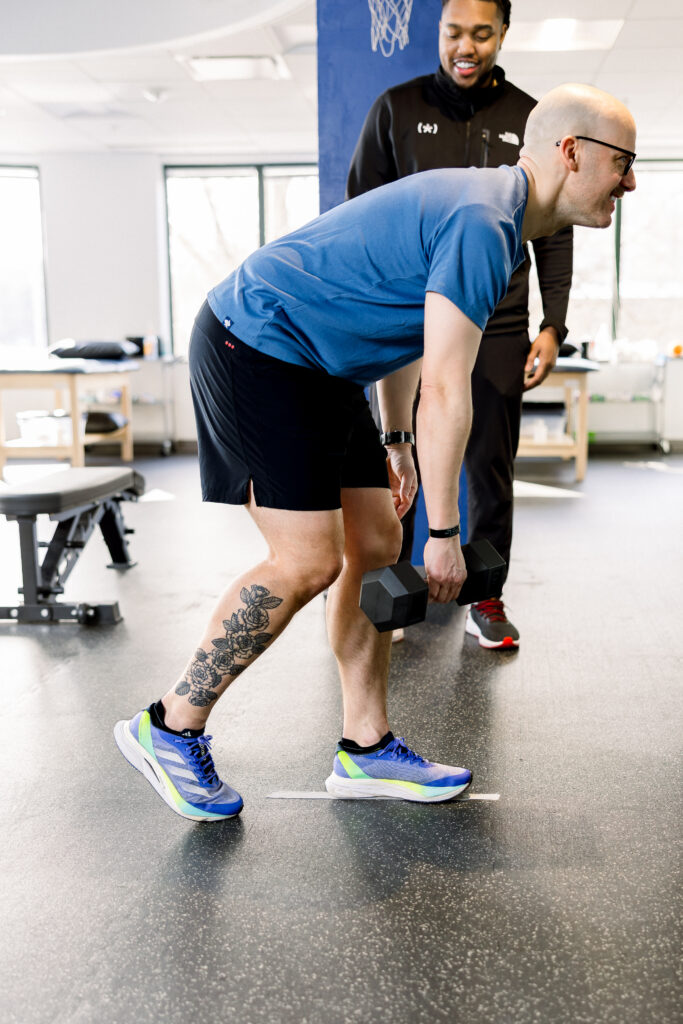 physical therapy session adult patient strength training rehabilitation guided exercise