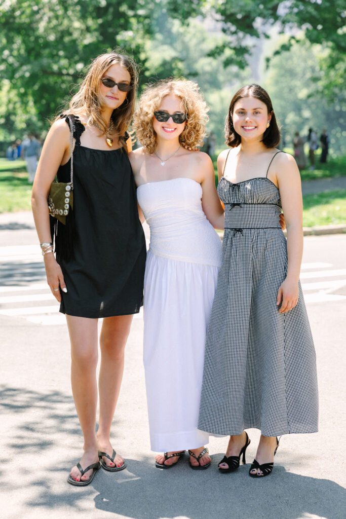 a college graduate posing with two friends